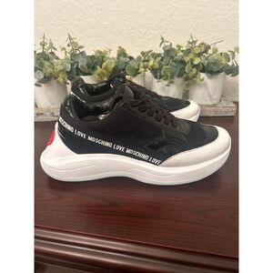 Love Moschino logo tape sneakers featuring black paneling and white sole 6.5